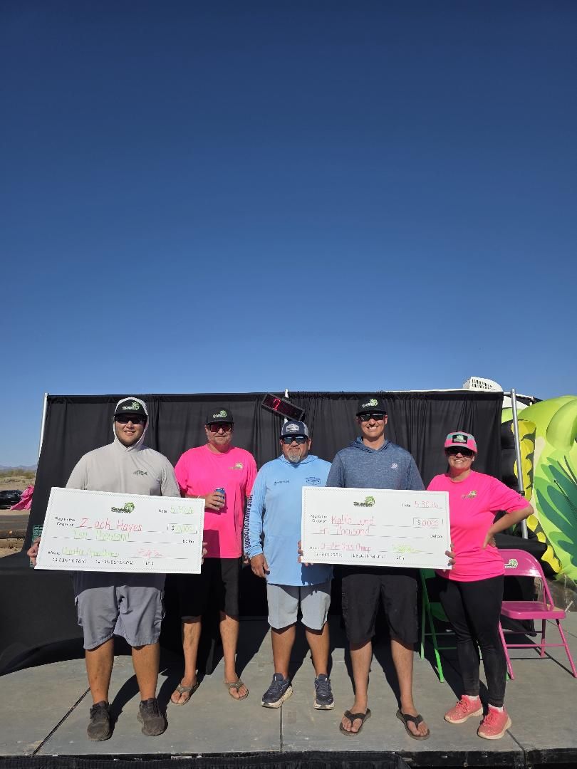 The 2026 champions and winners holding their prize checks on stage